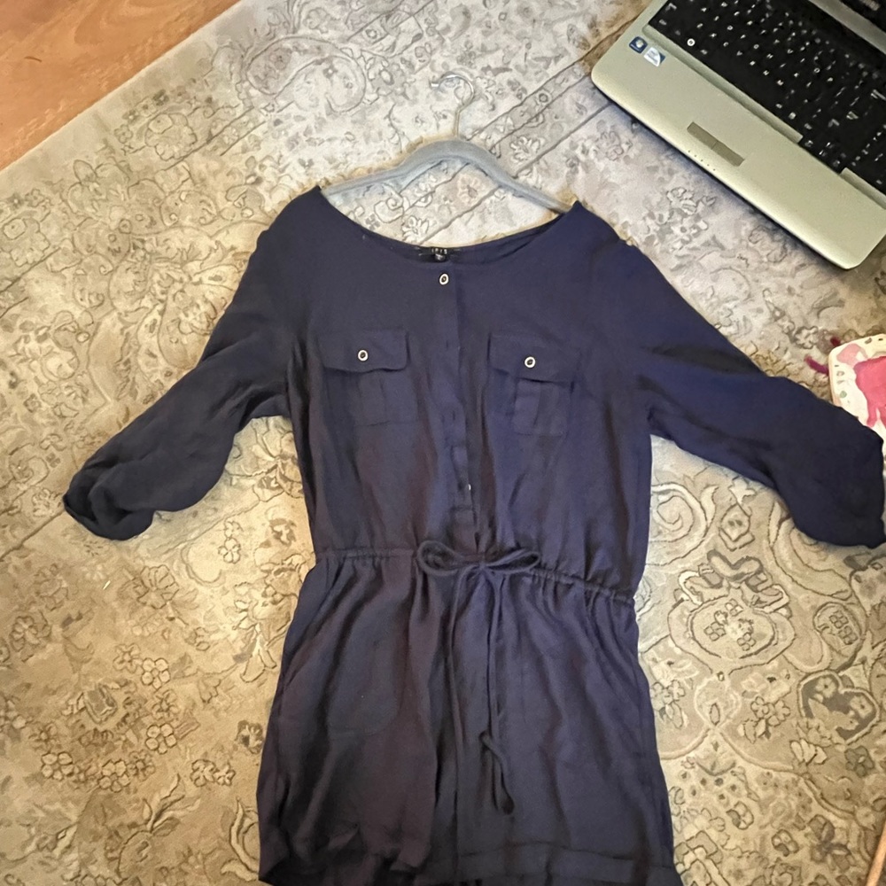 Super cute romper never worn. Buttons down the front